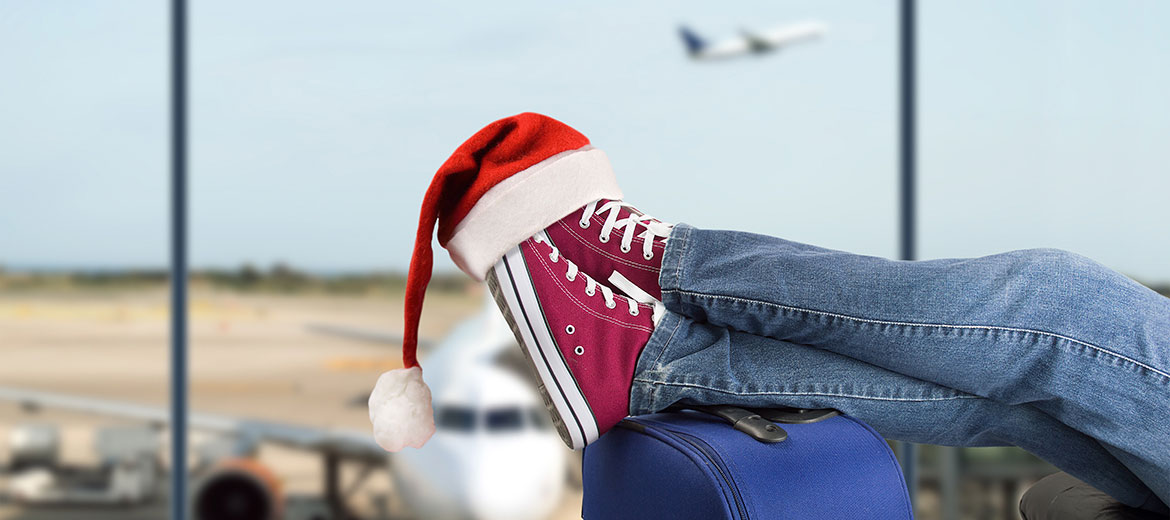 Parent relaxing at the airport during the holiday travel season